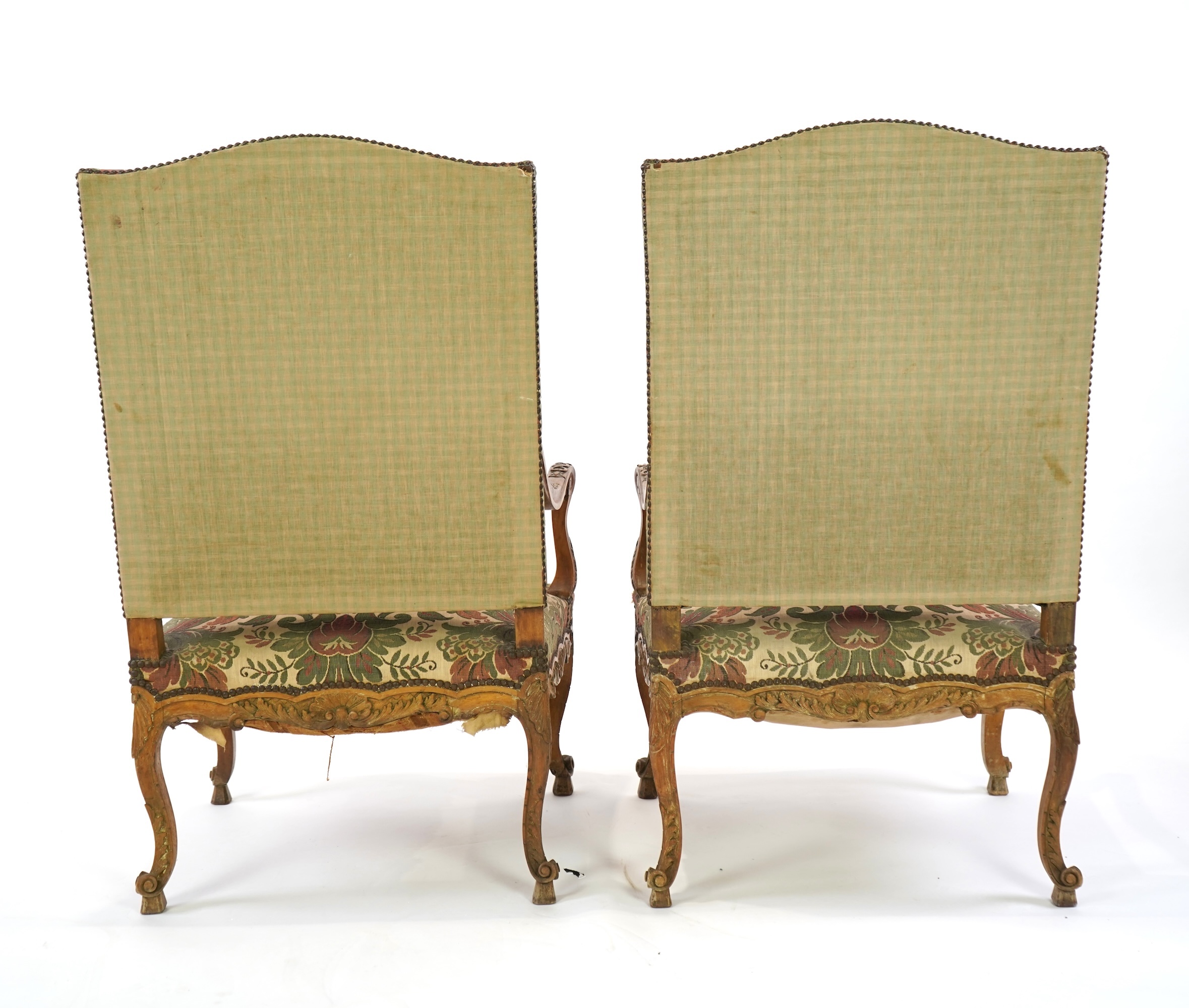A pair of 19th century Louis XV style carved walnut grand fauteuil